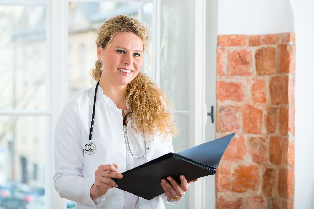 dentist with curly hair smiling | dentist sunnyvale ca
