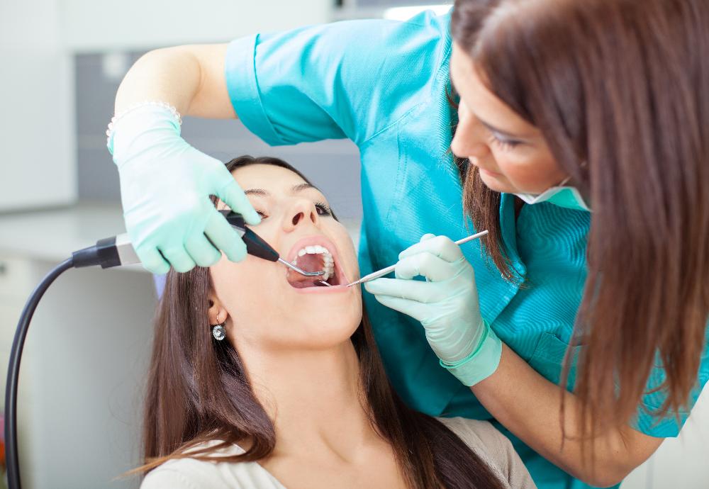 woman receiving dentist exam | sunnyvale ca dentist