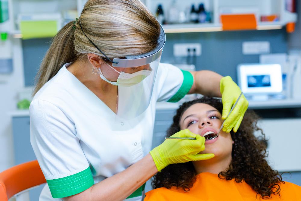 woman getting dental cleaning | cosmetic dentist sunnyvale ca