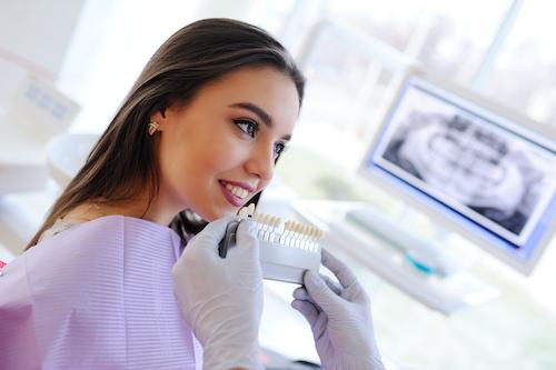 woman smiling in dentist office | porcelain veneers sunnyvale ca