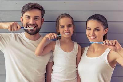 family of three brushing teeth | tooth-colored fillings sunnyvale ca