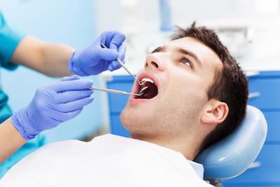 man receiving dental exam | teeth cleaning sunnyvale ca