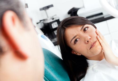 woman in pain holding jaw | emergency dentist sunnyvale ca