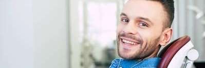 man sitting in dentist exam chair | dental fillings sunnyvale