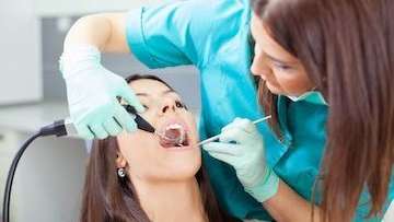 woman receiving dental exam | dentist sunnyvale