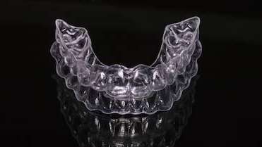 close up of clear plastic aligner | invisalign sunnyvale ca