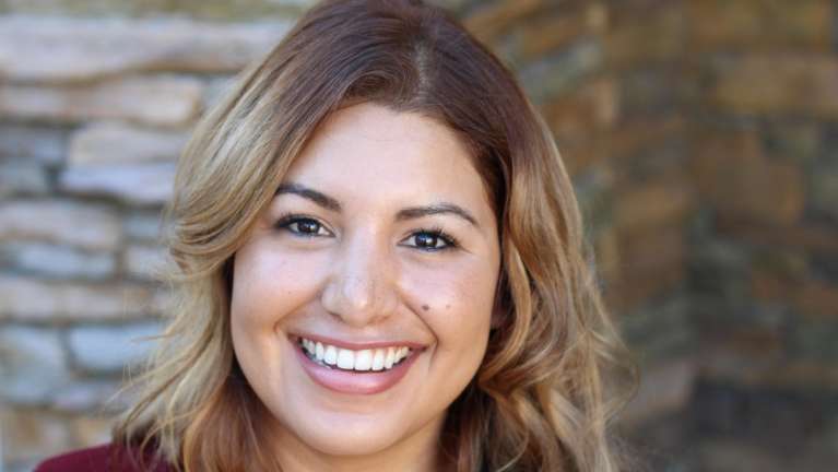 woman with brown hair smiling | dental crowns sunnyvale ca