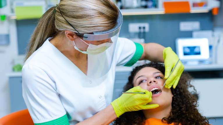 woman receiving dental exam | dentist sunnyvale ca