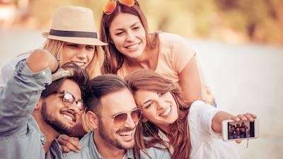 group of five adults smiling | invisalign sunnyvale ca