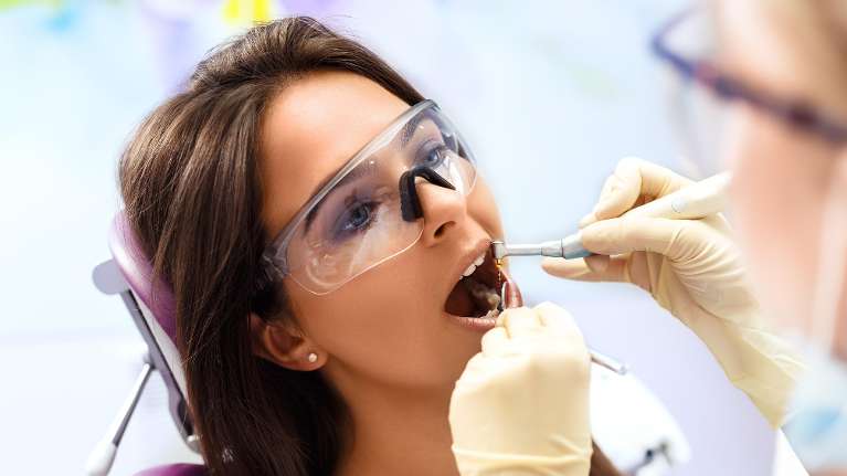 woman receiving dental exam | dentist sunnyvale ca