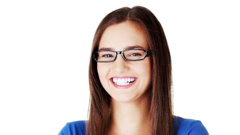 woman with glasses smiling | teeth cleanings sunnyvale ca