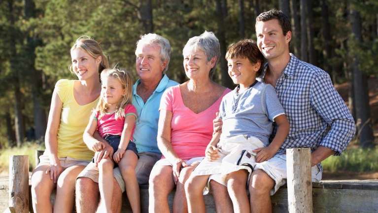 family of six sitting on dock | sunnyvale ca dentist