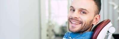 man smiling in dentist chair | cosmetic dentistry sunnyvale ca