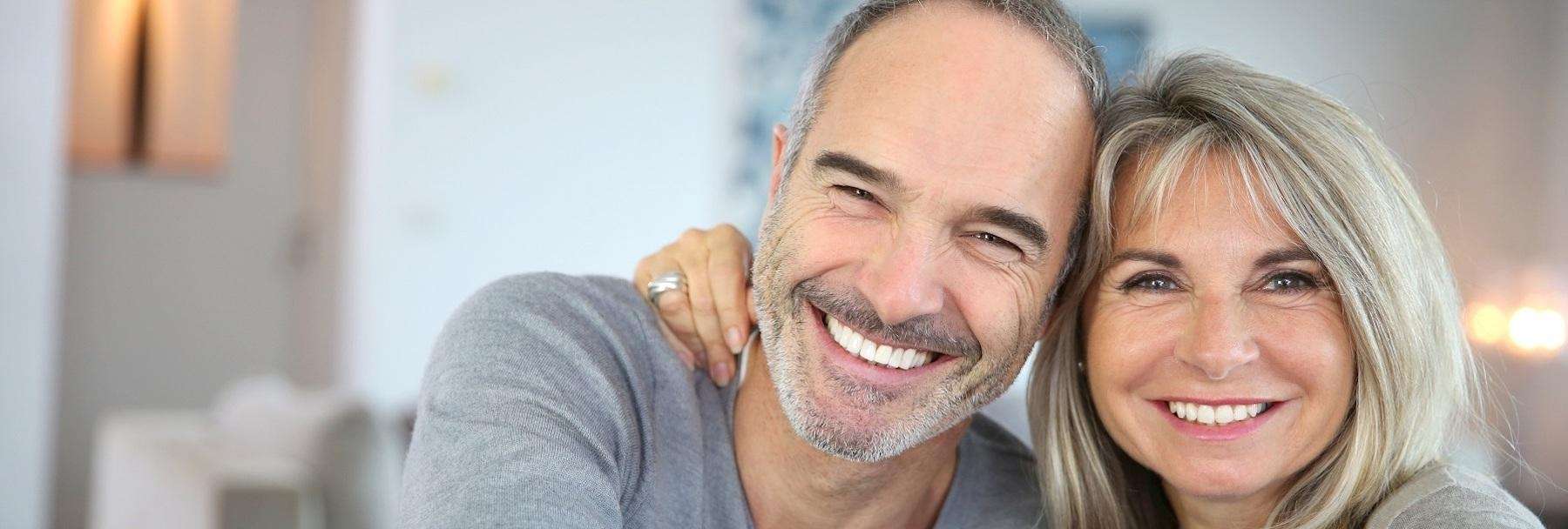 older couple hugging | dental crowns sunnyvale ca