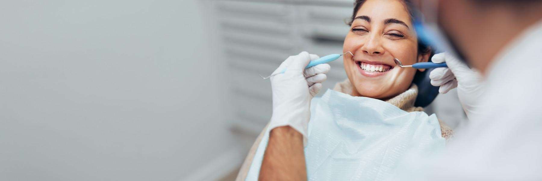 woman receiving dental exam | sunnyvale ca dentist