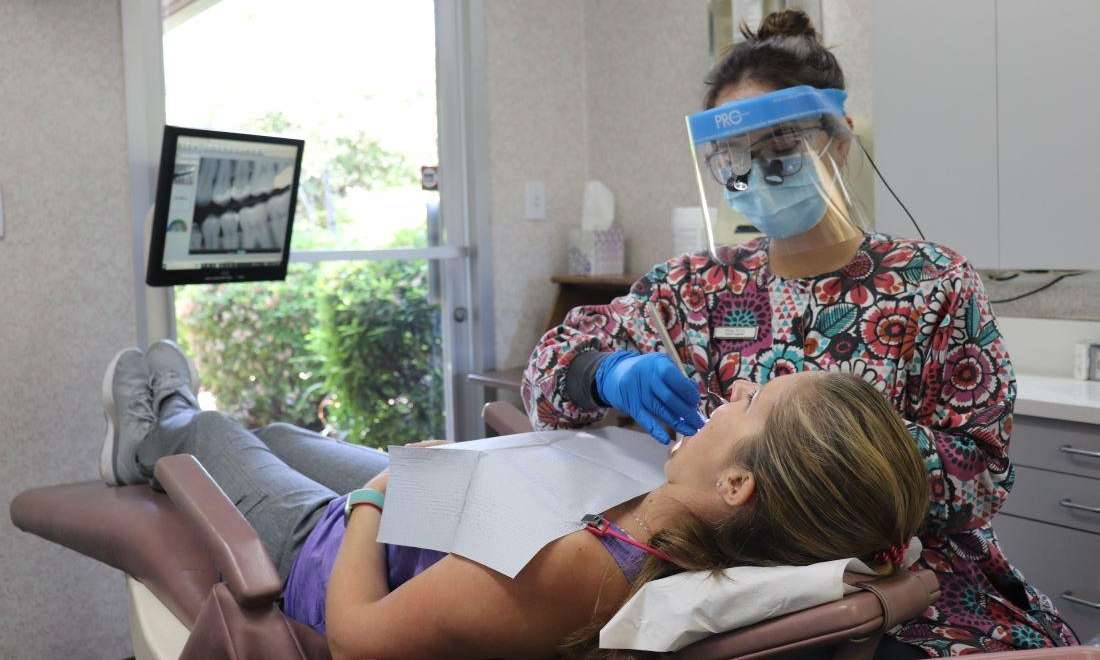 dental hygienist working on patient | dental office sunnyvale ca